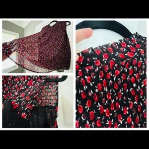 Flowy blouse. Black with red rose print. Shirred at the top. Torrid size 3